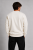 Tył męskiej bluzy crewneck premium w kolorze ecru. Prosty design bez nadruków oraz wysokiej jakości materiał podkreślają minimalistyczny i nowoczesny charakter bluzy unisex premium.